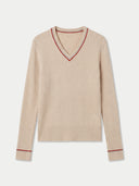A beige ribbed knit V-neck sweater with red contrast trim along the neckline and cuffs, displayed flat against a light gray background.