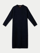 A dark navy blue long-sleeve knit dress with a crew neck, displayed flat against a light gray background. A small brown brand label reading 'GOBI' is visible inside the collar.