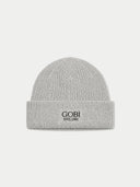 A light gray ribbed knit beanie hat with the brand name 'GOBI EST.1981' embroidered in black on the front cuff, set against a solid light gray background.