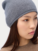 Model wearing the Women's Lightweight Seamless Cashmere Beanie in Steel Gray, close front view