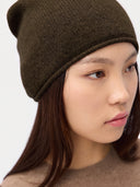 Model wearing the Women's Lightweight Seamless Cashmere Beanie in Olive Brown, close front view