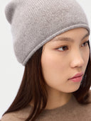 Model wearing the Women's Lightweight Seamless Cashmere Beanie in Light Gray, close front view