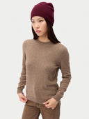 Model wearing the Women's Lightweight Seamless Cashmere Beanie in Wine Red, full-length front view