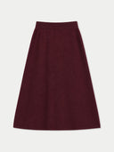 A dark burgundy A-line skirt with a wide waistband, shown flat against a light gray background.