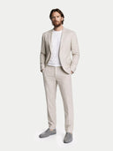 Man wearing a beige suit with a white shirt on a white background #color_steel-gray