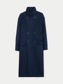 Navy blue coat with a high funnel neck on a light gray background #color_navy-blazer