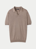 A beige silk cashmere polo shirt with a collar and short sleeves. #color_nomad