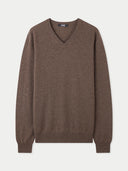 A brown essential cashmere V-neck sweater on a plain background. #color_cocoa