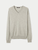 A gray Essential Cashmere V-Neck Sweater on a plain background. #color_dawn-blue