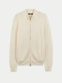 A full-zip cashmere cardigan in beige color with a stand-up collar and side pockets, zipped up and displayed against a neutral background. #color_marshmallow