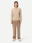 Men's Beige Cashmere Polo Sweater worn by model, front view on white background