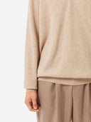 Men's Beige Cashmere Polo Sweater worn by model, detail view on white background