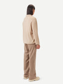 Men's Beige Cashmere Polo Sweater worn by model, back view on white background