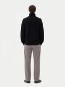 back view of a black jacket and gray pants on a white background #color_black