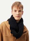 Man wearing a black knitted scarf and brown jacket on a white background #color_black