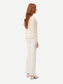 back view of a white V-neck cardigan and pants #color_off-white