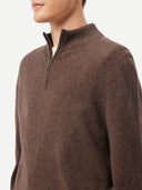 a zoomed - in shot of brown half zip sweater #color_cocoa