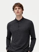 Man wearing a dark long-sleeve polo shirt against a plain background #color_charcoal