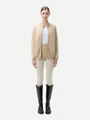 front view of a woman wearing brown cashmere  cardigan and underwear with white tights #color_beige