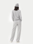 back view of a Person wearing a gray outfit with a beanie on a white background #color_vapor-blue