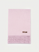 A light pink folded scarf with fringed edges and a small brown rectangular brand label, shown on a clean off-white background.