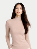 Woman wearing a beige mock neck sweater on a white background #color_beige