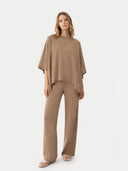 front view of a woman wearing a brown outfit on a white background #color_taupe