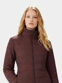 Woman wearing a brown puffer jacket on a white background #color_vineyard-wine