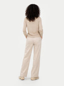 back view of a beige suit standing against a white background #color_warm-grey