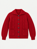 A red cable-knit cardigan sweater with a collar, front buttons, and two front pockets, shown flat against a light gray background.