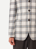 close up of a checkered white gray blazer #color_off-white