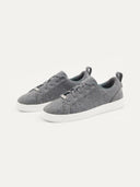 A pair of gray low-top cashmere ankle sneakers with lace-up closure. #color_stone-gray