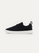 side view of a black cashmere sneaker with white rubber sole #color_black