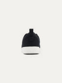 back view of a black sneaker with white rubber sole #color_black