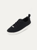 A side profile view of a black high-top sneaker with a textured knit upper and black laces, featuring a thick white rubber sole and a pull tab at the heel. #color_black