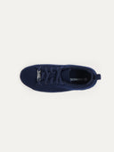 A top-down view of a navy sneaker with a textured knit upper and matching navy laces. The interior features a tan insole with the "GOBI" logo and "CASHMERE" printed in dark text, all set against a white background. #color_navy