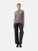 front view - woman wearing a light brown polo sweater and black pants #color_stucco