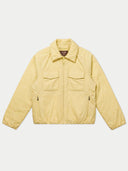 A light yellow utility jacket with a zip-up front, collar, and two flap chest pockets, laid flat against a light gray background.