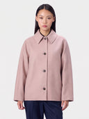 Model wearing the Cashmere Oval-Sleeve Melton Jacket in Blush Brown, front view