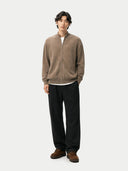 front view of a man wearing a brown zip-up cardigan and black pants on a white background #color_taupe