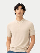Man wearing a beige polo shirt against a white background #color_marshmallow