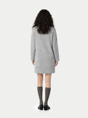 back view of a person wearing a gray dress on a white background #color_high-rise
