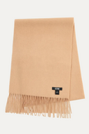 Beige scarf with fringes and a visible brand label on a light gray background