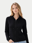 close up of a black hoodie against a light gray background #color_black