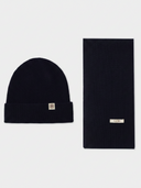 flat lay of a black beanie and textured scarf with a brand label "GOBI" #color_black