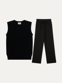 Black sleeveless top and black pants on a white background #color_black