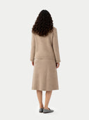back view of a woman wearing a beige knit dress set on a white background #color_warm-grey