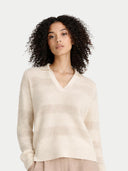 Woman wearing a cream sweater on a white background #color_off-white