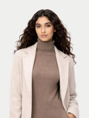 Woman wearing a beige coat over a brown turtleneck dress on a white background #color_taupe
