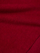 Close-up of red fabric with a textured pattern bordeaux